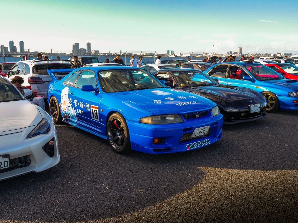 Tuned cars lined up at a meet